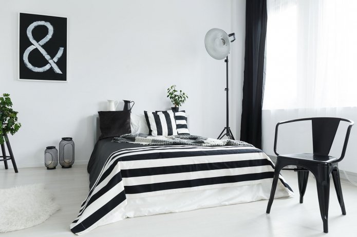 stylish bedroom with an unusual floor lamp