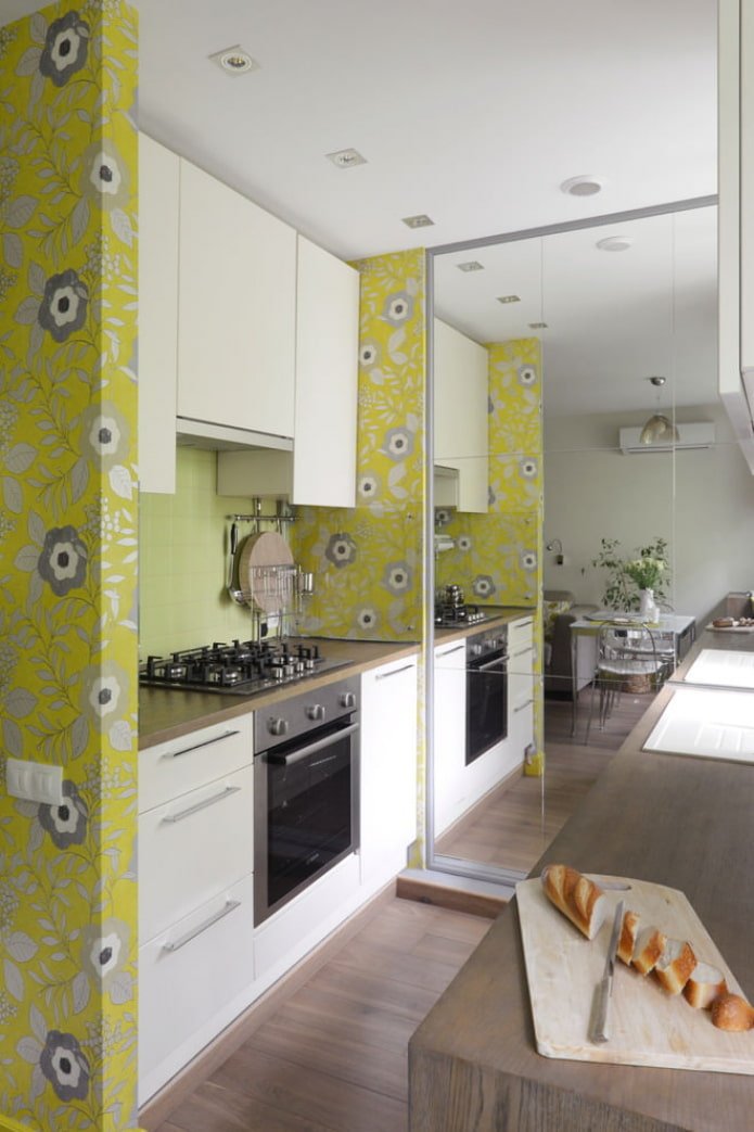 a full-wall mirror in the kitchen