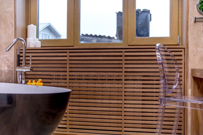 radiators in the bathroom are hidden using a wooden box