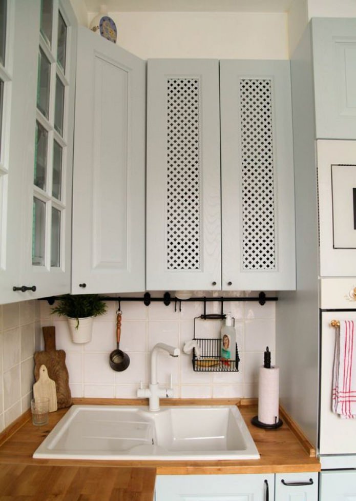 hide pipes in a kitchen cabinet