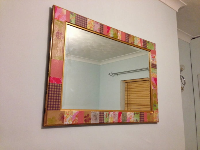 mirror with a frame made of wallpaper