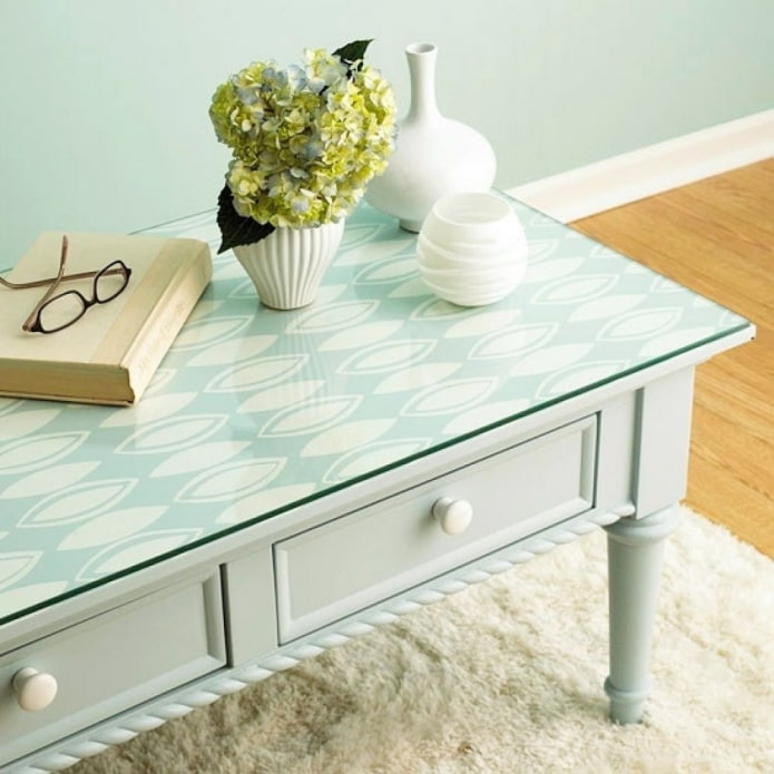 table with a piece of wallpaper under glass