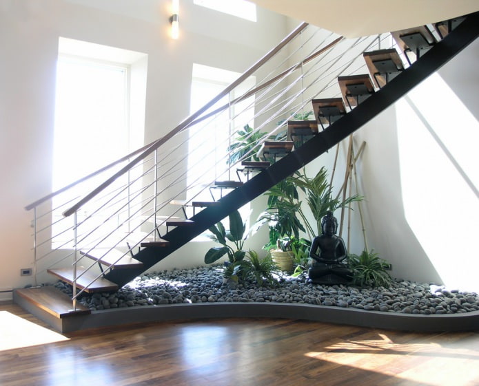 Garden with rocks under the staircase