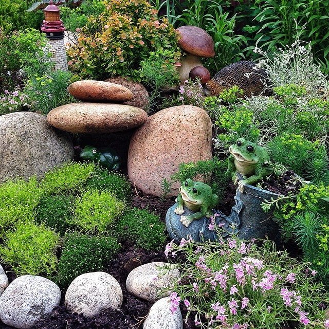 decorating an alpine slide with garden figurines