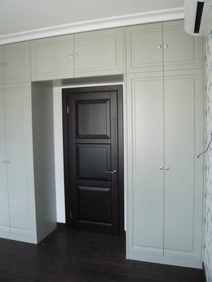 arch of cabinets with a mezzanine