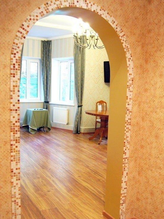 arch with mosaic in the interior of the hallway