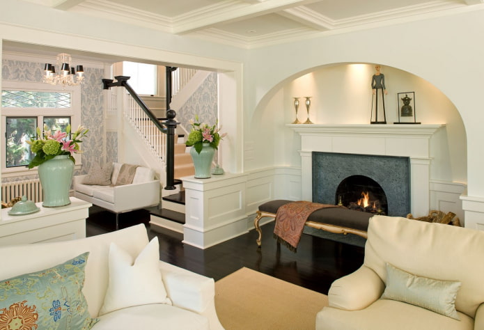 arch in the interior of the living room with a fireplace