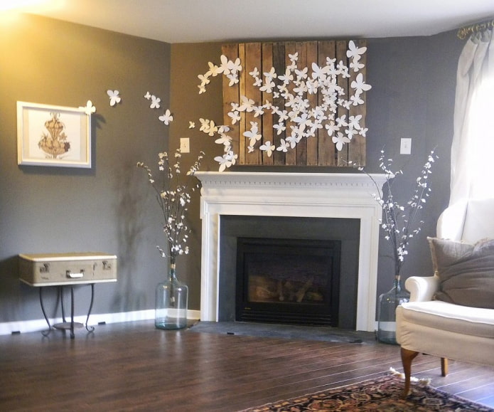paper butterflies above the fireplace