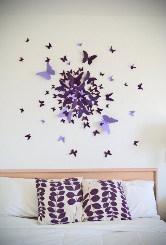 paper butterflies above the bed