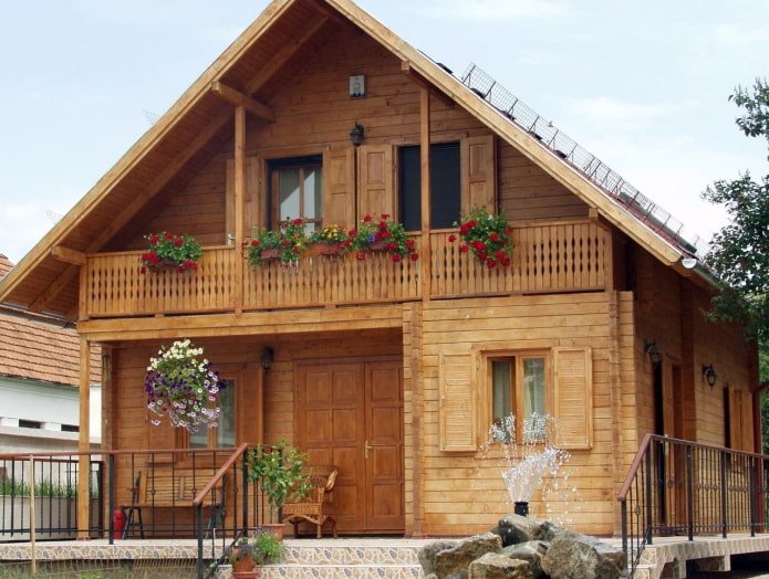 project of a wooden house with a balcony