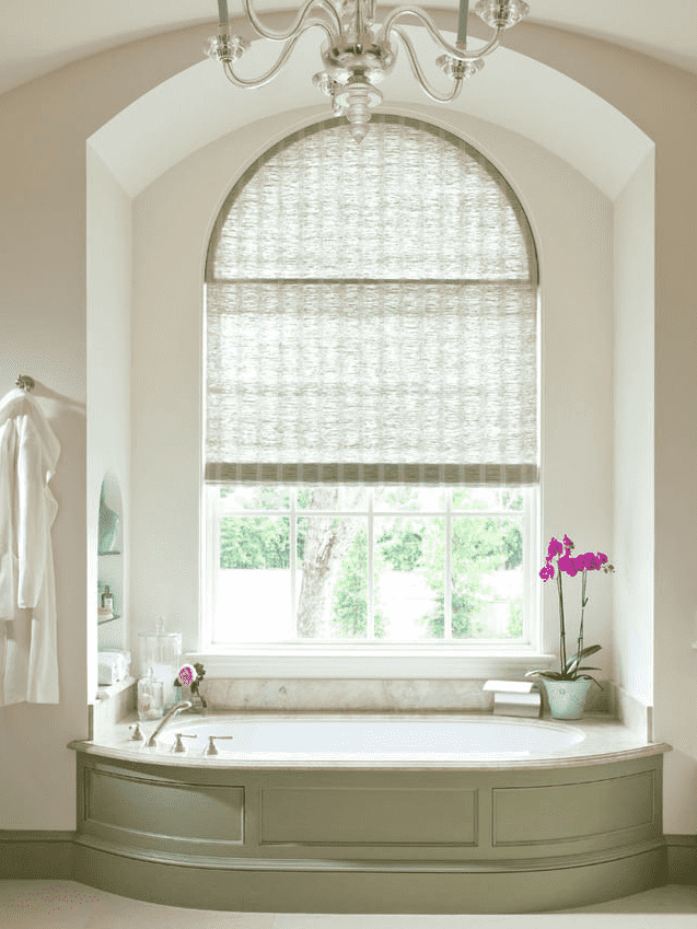 bamboo roller blinds on an arched window