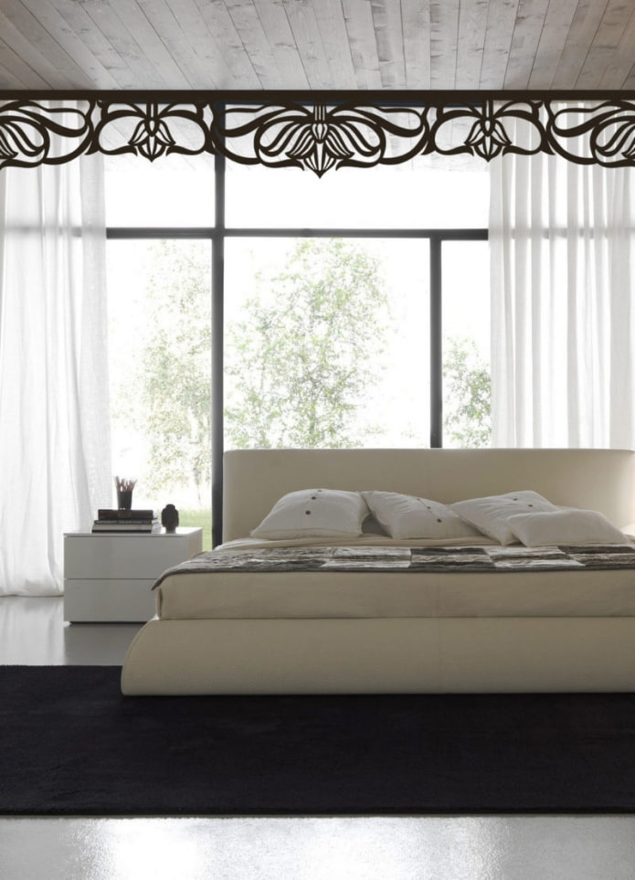 openwork lambrequin in the interior of a bedroom
