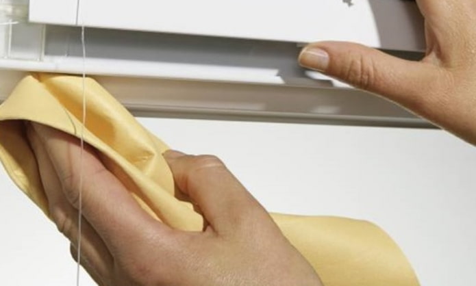 cleaning the curtain rod from dust