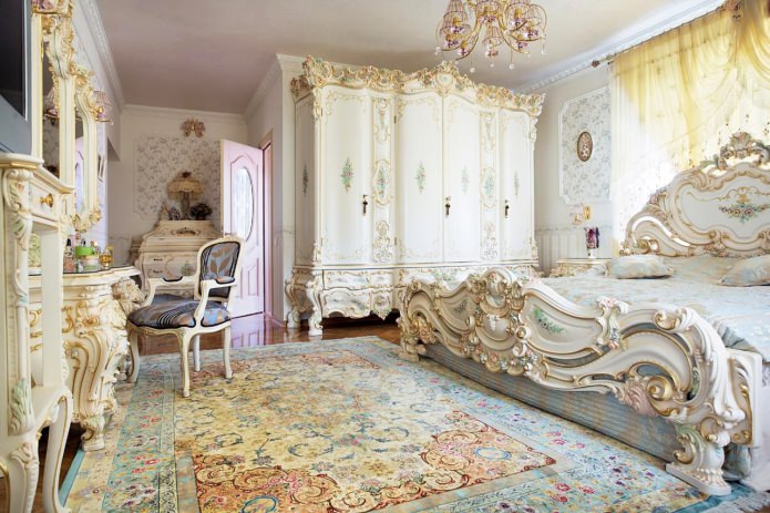 wooden white bed with carving