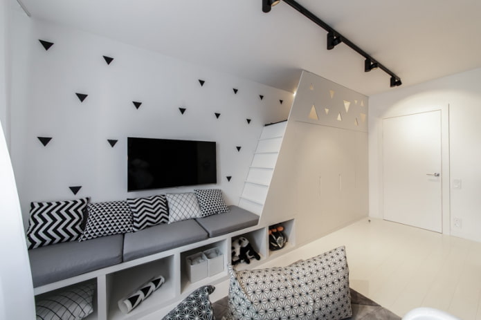 small sofa with black and white pattern on pillows