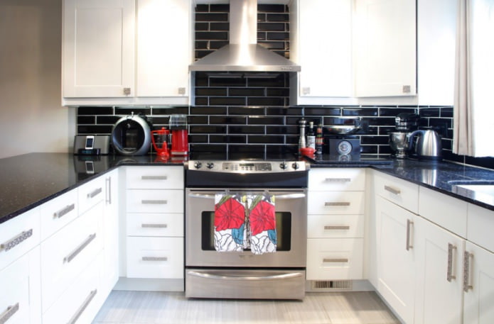 black apron under a brick in a white kitchen