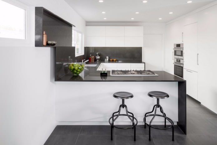 U-shaped black and white kitchen