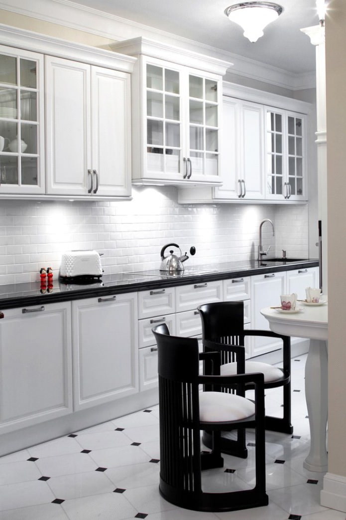 white brick-effect backsplash and black countertop