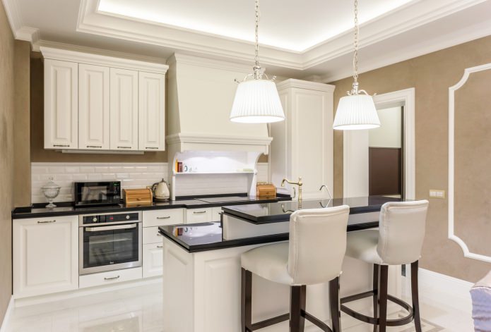 classic light kitchen with a black countertop