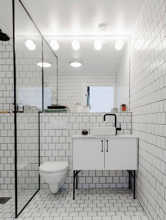 white tiles with grout in the bathroom interior