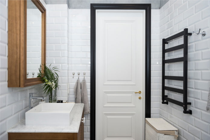finishing in the interior of the bathroom in white tones