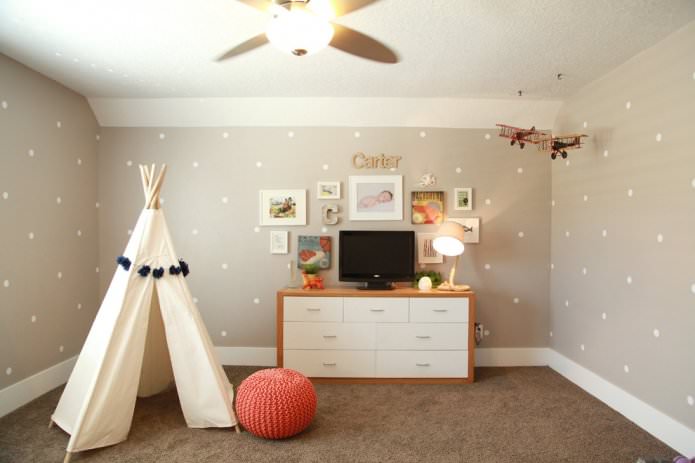 beige polka dot wallpaper in a child's room 