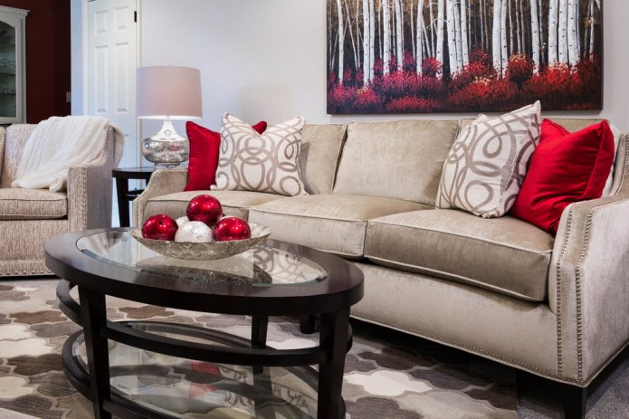 Beige sofa with red pillows