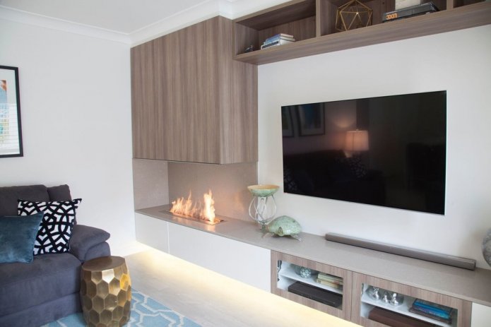 living room interior with a bio-fireplace built into the countertop