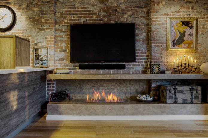loft-style interior with a fireplace