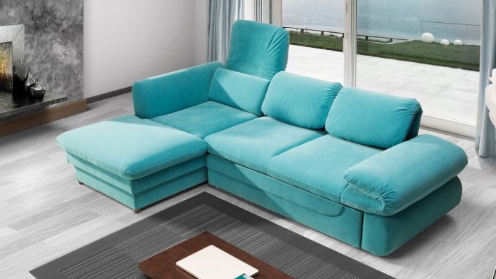 turquoise sofa on a gray floor