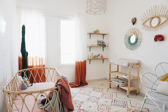 a nursery for a newborn in boho style