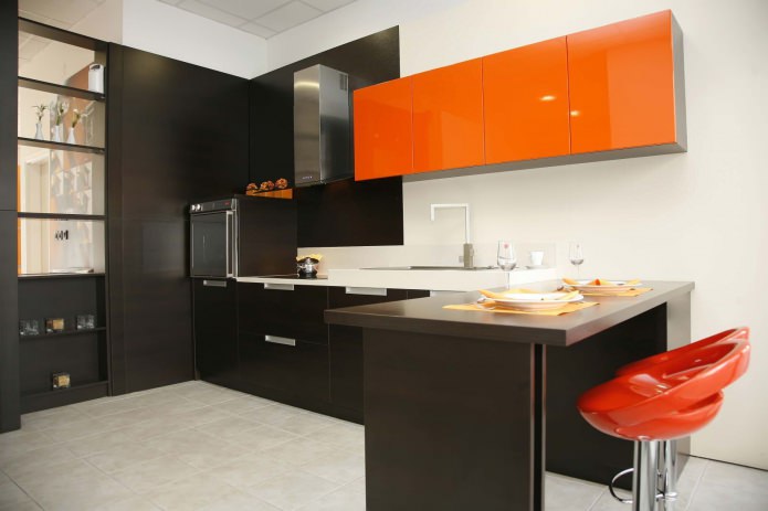 Black and orange kitchen set with a bar counter