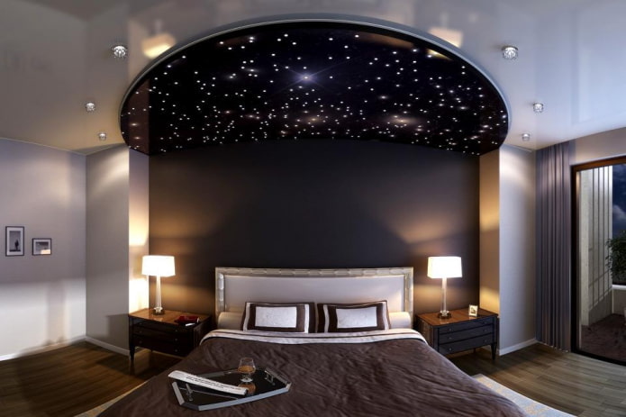 stretched ceiling with the effect of a black starry sky