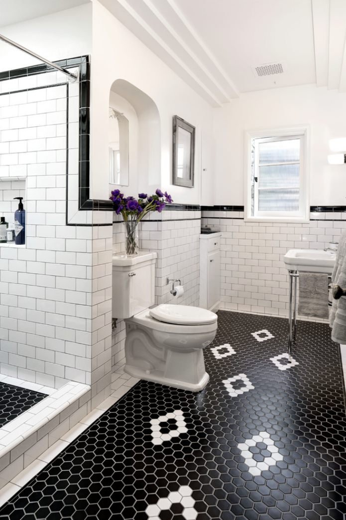 white inserts in black tiles on the floor
