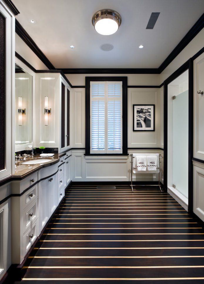 gold stripes on black flooring
