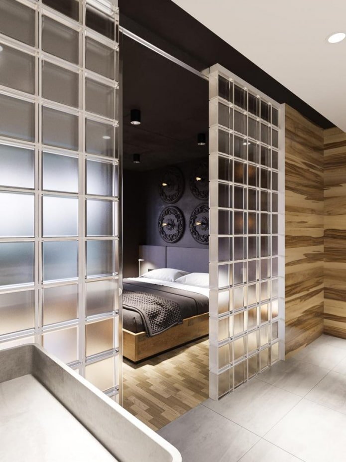 bedroom separated by glass blocks