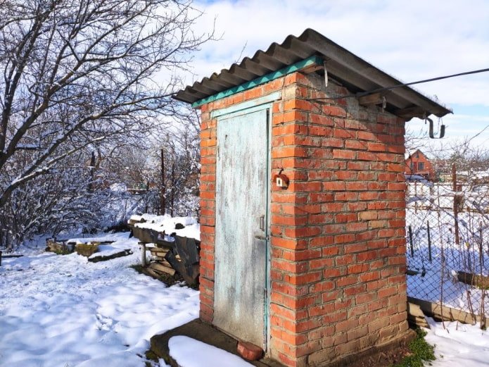 brick toilet in winter
