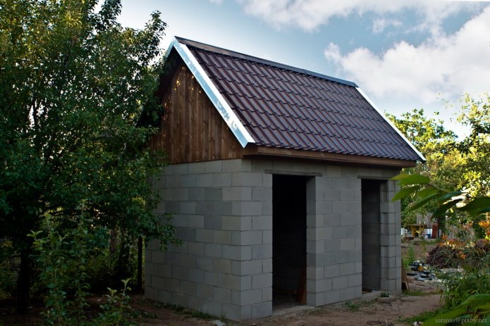 country toilet with a shower made of foam blocks