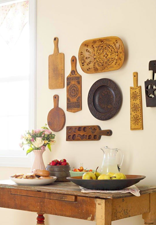 cutting boards on the wall in the kitchen