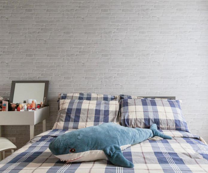brick wallpaper in the bedroom interior