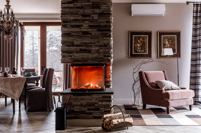 decorative stone finishing of the fireplace in the interior