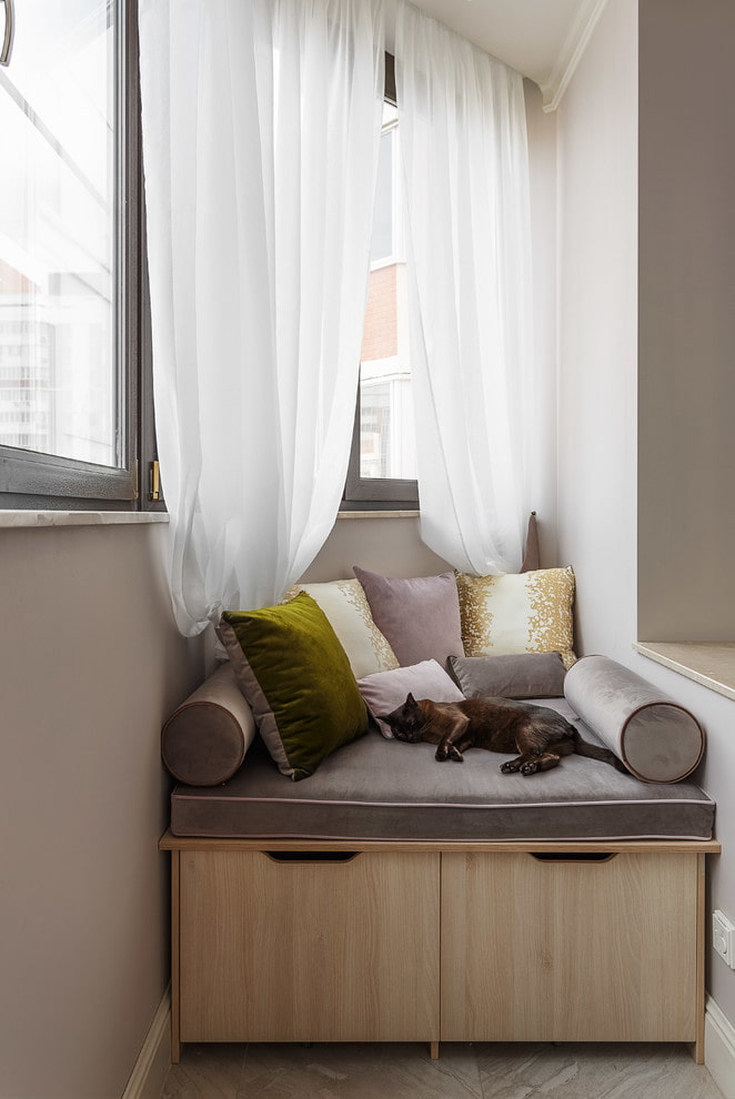 sofa with storage drawers on the loggia