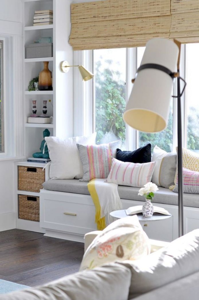 sofa with cabinets by the window sill