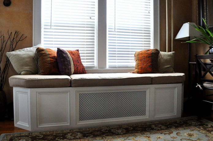 small sofa under the window