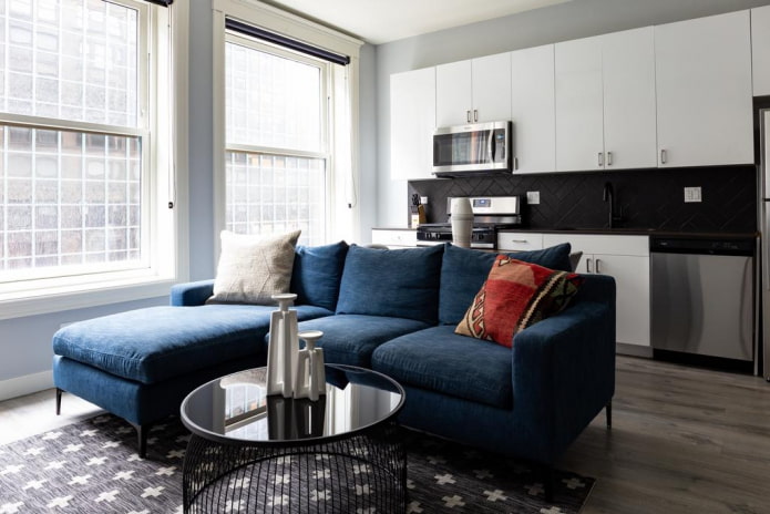 sofa model with a blue ottoman in the interior