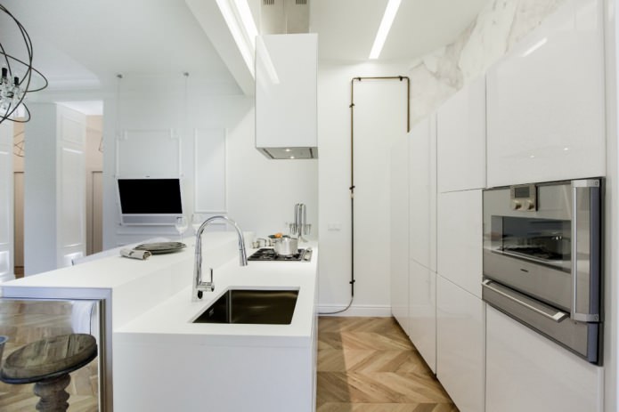 Interior of a combined kitchen-living room with a bar counter