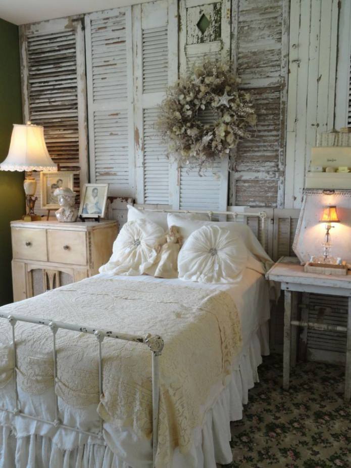 accent wall in the bedroom interior is decorated with aged boards
