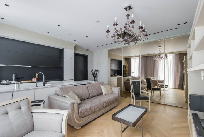 arrangement of furniture in the kitchen-living room of 17 square meters