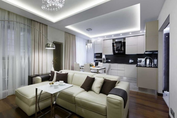 kitchen-living room 20 sq. m with a sofa by the window
