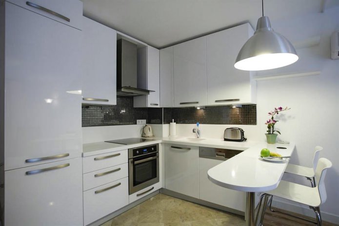Design of a corner kitchen with a bar counter